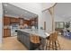 Spacious kitchen with stone countertops, wood cabinets, stainless steel appliances and a center island at 4312 Mystic Ln, Hillsborough, NC 27278