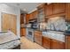 Traditional kitchen features wood cabinets, stainless steel appliances, and a farmhouse sink at 4312 Mystic Ln, Hillsborough, NC 27278
