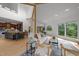 Open-concept living space features a modern design, tall windows, and hardwood floors at 4312 Mystic Ln, Hillsborough, NC 27278