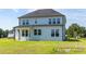 Two-story house with a large backyard and patio at 444 Golden Dragonfly St, Wake Forest, NC 27587
