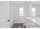 Bathroom featuring a bathtub-shower combo, toilet, and vanity with white cabinetry and dark wood-look flooring at 444 Golden Dragonfly St, Wake Forest, NC 27587