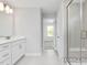 Bright bathroom with a glass door shower and white cabinets at 444 Golden Dragonfly St, Wake Forest, NC 27587