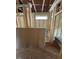 Unfinished bathroom featuring insulation, exposed wooden beams, and a window at 444 Golden Dragonfly St, Wake Forest, NC 27587