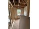 An unfinished bedroom featuring insulation, exposed wooden beams, and a window at 444 Golden Dragonfly St, Wake Forest, NC 27587