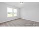 Bedroom with carpet and two windows, offering natural light and a peaceful atmosphere at 444 Golden Dragonfly St, Wake Forest, NC 27587