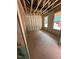 Unfinished bedroom with exposed insulation, studs and windows, awaiting customization at 444 Golden Dragonfly St, Wake Forest, NC 27587