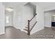 Welcoming foyer featuring luxury vinyl plank flooring, staircase, and entry to living spaces at 444 Golden Dragonfly St, Wake Forest, NC 27587