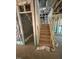 View of the wooden staircase under construction with visible framework and insulated walls at 444 Golden Dragonfly St, Wake Forest, NC 27587