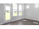 Bright sun room featuring gray wood flooring, natural light, and views to the outside at 444 Golden Dragonfly St, Wake Forest, NC 27587