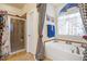 Bathroom featuring a jacuzzi tub, separate shower, and beautiful curtains at 46 Spring Haven Ln, Willow Springs, NC 27592