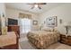 Cozy bedroom with a ceiling fan, plush bedding, and an inviting window view at 46 Spring Haven Ln, Willow Springs, NC 27592