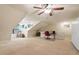 Spacious bonus room featuring neutral carpet, dormer windows and ample space for recreation and relaxation at 46 Spring Haven Ln, Willow Springs, NC 27592