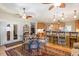 View of kitchen, dining room, and breakfast bar with hardwood floors and recessed lighting at 46 Spring Haven Ln, Willow Springs, NC 27592
