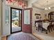 Bright entryway features glass-paneled front door and dining area at 46 Spring Haven Ln, Willow Springs, NC 27592