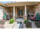 Covered front porch with sitting area at 46 Spring Haven Ln, Willow Springs, NC 27592