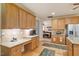 Kitchen featuring granite countertops and a desk area with wooden cabinets at 46 Spring Haven Ln, Willow Springs, NC 27592