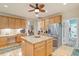 Beautiful kitchen with stainless steel refrigerator and central island with granite top at 46 Spring Haven Ln, Willow Springs, NC 27592