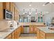 Spacious kitchen with stainless appliances, granite counters, and hardwood flooring at 46 Spring Haven Ln, Willow Springs, NC 27592