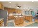 Open kitchen featuring stainless steel appliances, central island, and hardwood floors at 46 Spring Haven Ln, Willow Springs, NC 27592