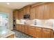 Well-equipped kitchen with built-in oven and a view into the laundry room at 46 Spring Haven Ln, Willow Springs, NC 27592