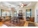 Bright living room with hardwood floors and large windows, showcasing natural light at 46 Spring Haven Ln, Willow Springs, NC 27592