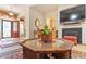 Cozy living room featuring a fireplace, TV, and charming decor throughout at 46 Spring Haven Ln, Willow Springs, NC 27592