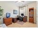 Well-lit office featuring a desk, built-in shelves, and comfortable seating at 46 Spring Haven Ln, Willow Springs, NC 27592