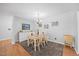 Warm dining area with hardwood floors and an open concept into the kitchen at 4709 Edwards Mill Rd # H, Raleigh, NC 27612