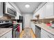 Updated kitchen features stainless steel appliances, granite countertops, and a stylish backsplash at 4709 Edwards Mill Rd # H, Raleigh, NC 27612