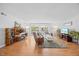Inviting living room features hardwood flooring, a large window, and well-placed furniture at 4709 Edwards Mill Rd # H, Raleigh, NC 27612