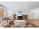 Cozy living room with a decorative ottoman, media center, and views from a large sliding glass door at 4709 Edwards Mill Rd # H, Raleigh, NC 27612
