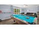 Beautiful game room boasts a full-size pool table with a large window view at 5129 Neighbors Rd, Mebane, NC 27302