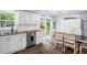 Bright kitchen features stainless steel appliances, wood countertops and backyard access at 5129 Neighbors Rd, Mebane, NC 27302