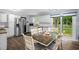 Bright kitchen with stainless steel appliances and adjacent dining area with backyard access at 5129 Neighbors Rd, Mebane, NC 27302
