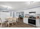 Open-concept living area showcases the kitchen, dining, and game room at 5129 Neighbors Rd, Mebane, NC 27302
