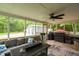 Charming sunroom featuring a cozy seating area and views of the surrounding landscape at 5129 Neighbors Rd, Mebane, NC 27302