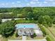 Aerial view of a sparkling pool and clubhouse surrounded by lush greenery and community amenities at 5312 Suntan Lake Dr, Raleigh, NC 27610