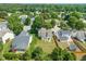 Aerial view of the home showing its placement in a neighborhood with mature trees and ample backyard space at 5312 Suntan Lake Dr, Raleigh, NC 27610