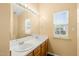 The bathroom has double sinks, large mirrors, and natural light at 5312 Suntan Lake Dr, Raleigh, NC 27610
