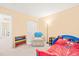 Cozy bedroom featuring carpet floors, neutral walls, and colorful decor, creating a playful space at 5312 Suntan Lake Dr, Raleigh, NC 27610