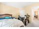 This bedroom comes with an unmade bed and plenty of space at 5312 Suntan Lake Dr, Raleigh, NC 27610