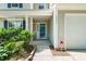 Charming home entrance with a welcoming porch, well-manicured landscaping, and convenient garage access at 5312 Suntan Lake Dr, Raleigh, NC 27610