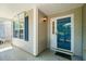 Inviting front porch with a blue-trimmed door, ample space, and shaded from the elements at 5312 Suntan Lake Dr, Raleigh, NC 27610