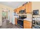 Functional kitchen features stainless steel appliances and durable laminate countertops at 5312 Suntan Lake Dr, Raleigh, NC 27610