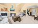 Bright and airy living room with vaulted ceilings, fireplace, and open staircase leading to the second floor at 5312 Suntan Lake Dr, Raleigh, NC 27610