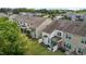 Aerial shot of row of houses with green lawns and trees on a sunny day at 5320 Jessip St, Morrisville, NC 27560