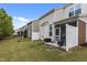 Backyard showing row of houses with screen porches, a fence and green grass at 5320 Jessip St, Morrisville, NC 27560
