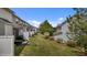 Exterior view of backyard with fenced perimeter, well-maintained lawn, and neighboring houses at 5320 Jessip St, Morrisville, NC 27560