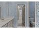 Eye-catching patterned wallpaper and a bright vanity create an appealing bathroom space at 5320 Jessip St, Morrisville, NC 27560