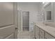 Bright bathroom with double vanity, tiled floor, walk-in shower, and water closet at 5320 Jessip St, Morrisville, NC 27560